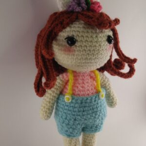 A crochet spring doll with a white background