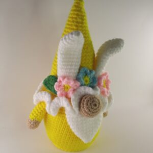 A crochet easter gnome with a white background